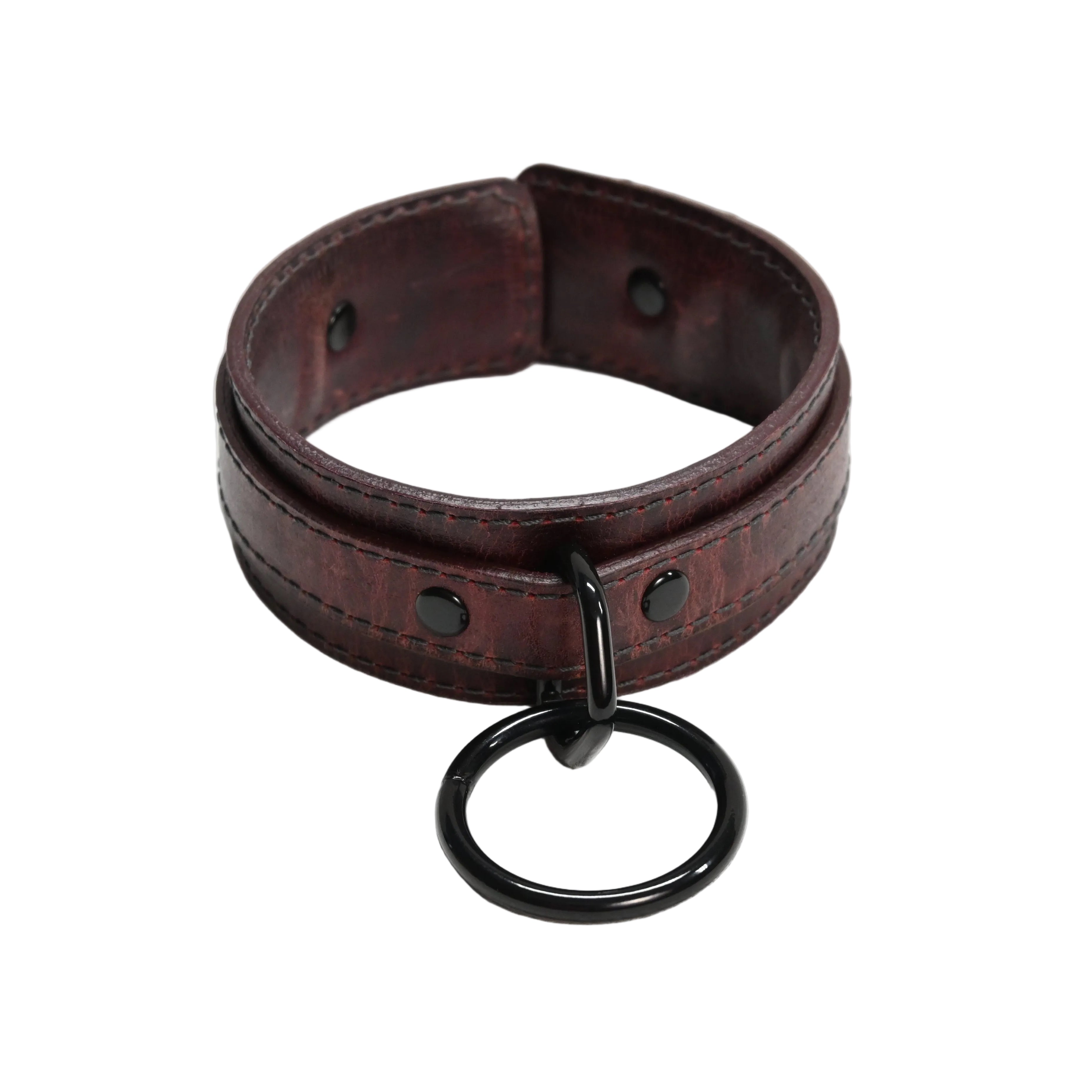 A dark red leather collar with a black metal O-ring and black rivets, displayed on a white background.