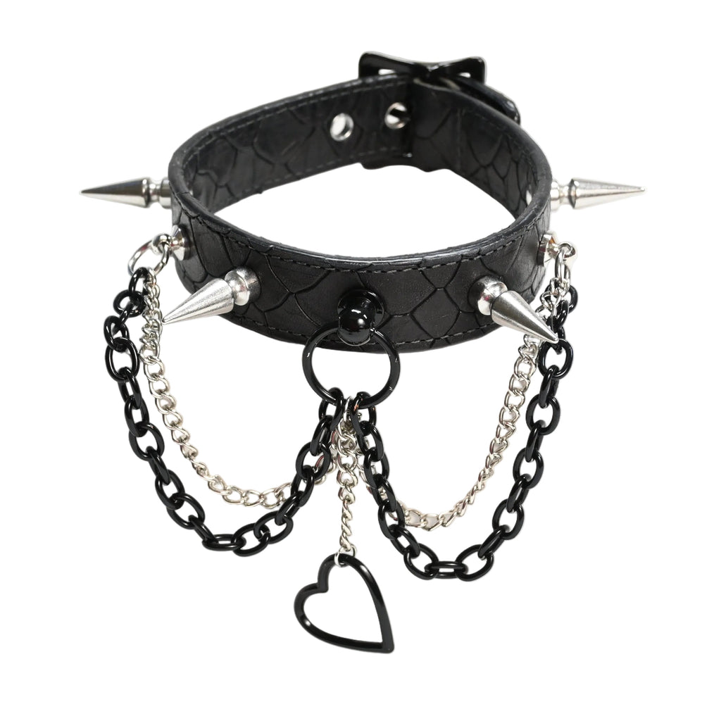 Black spiked collar with silver chains, spikes, and a heart-shaped charm, displayed on a white background.