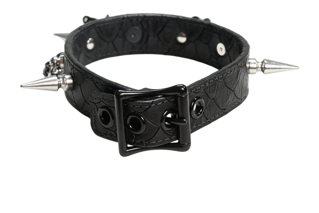 A black textured leather spiked collar with a black metal buckle, displayed on a white background.