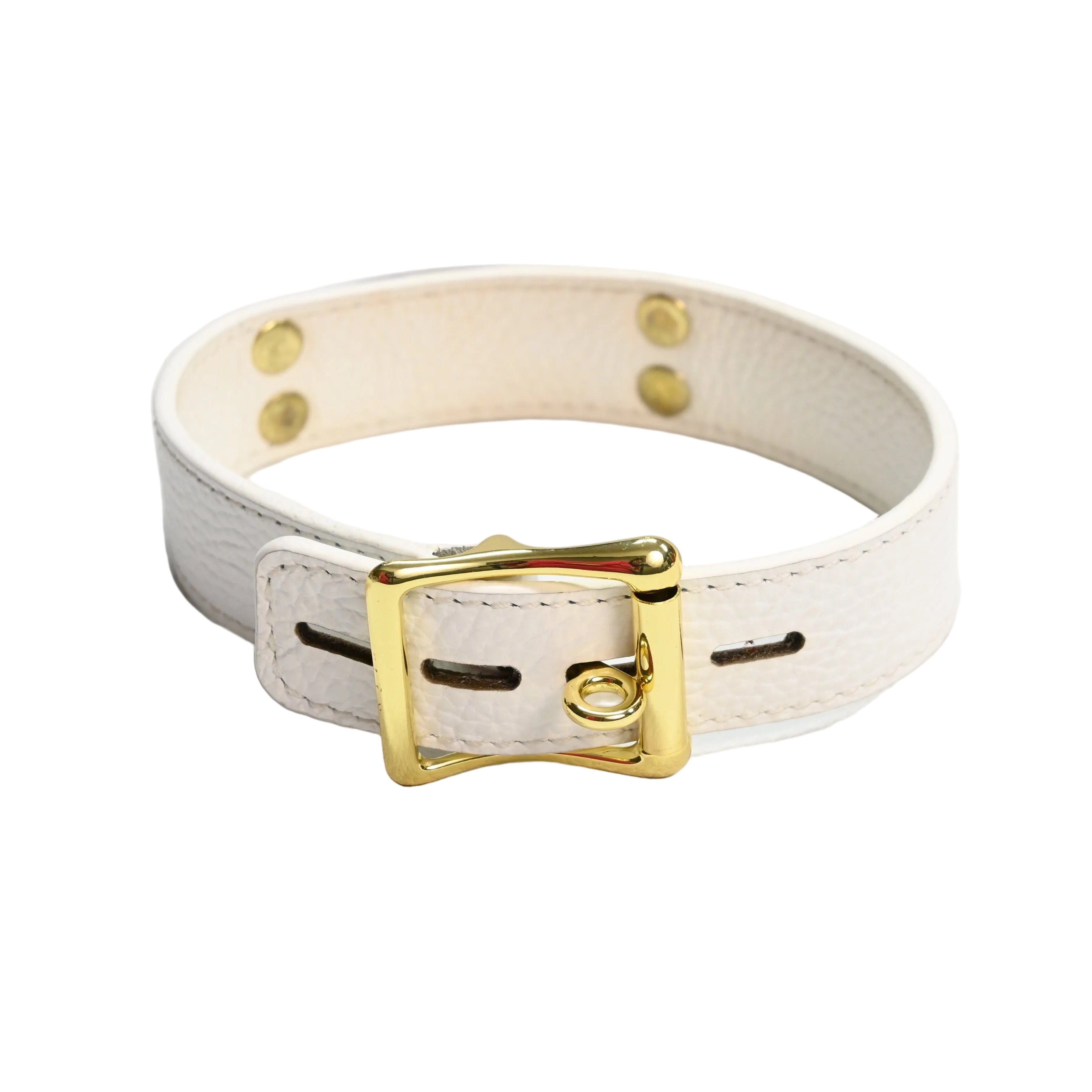 A white leather collar accented by gold rivets and a gold buckle.