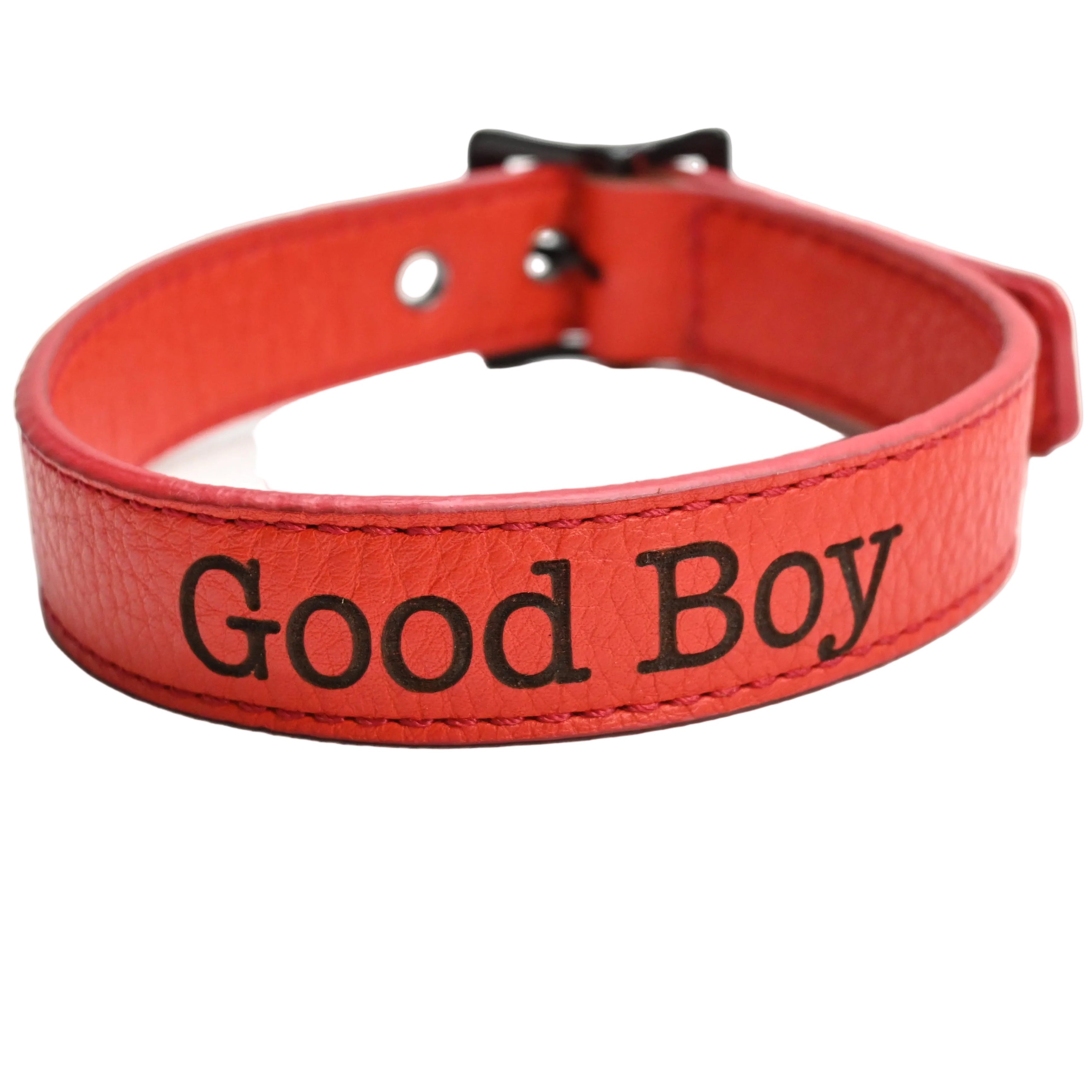 A red leather collar with black hardware and the words 'Good Boy' in black on the front, set against a plain white background.