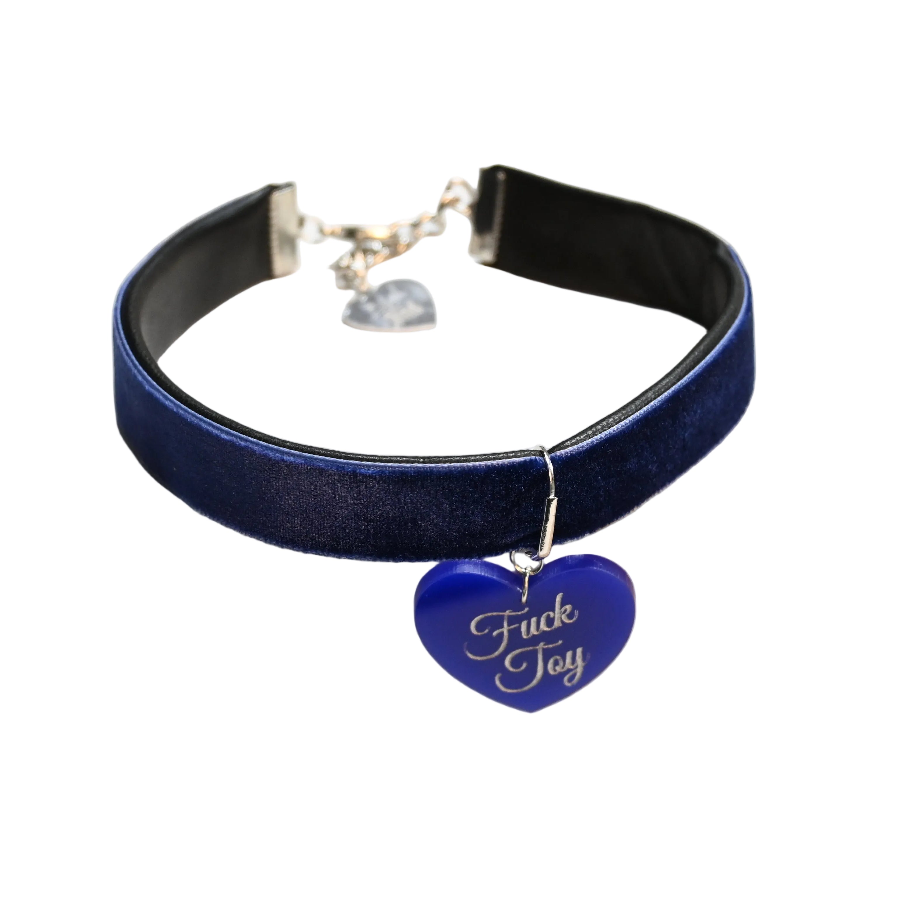 A dark blue velvet choker collar with a silver-tone metal clasp and a blue heart-shaped charm engraved with the words 'Fuck Toy' in white script, displayed on a white background.
