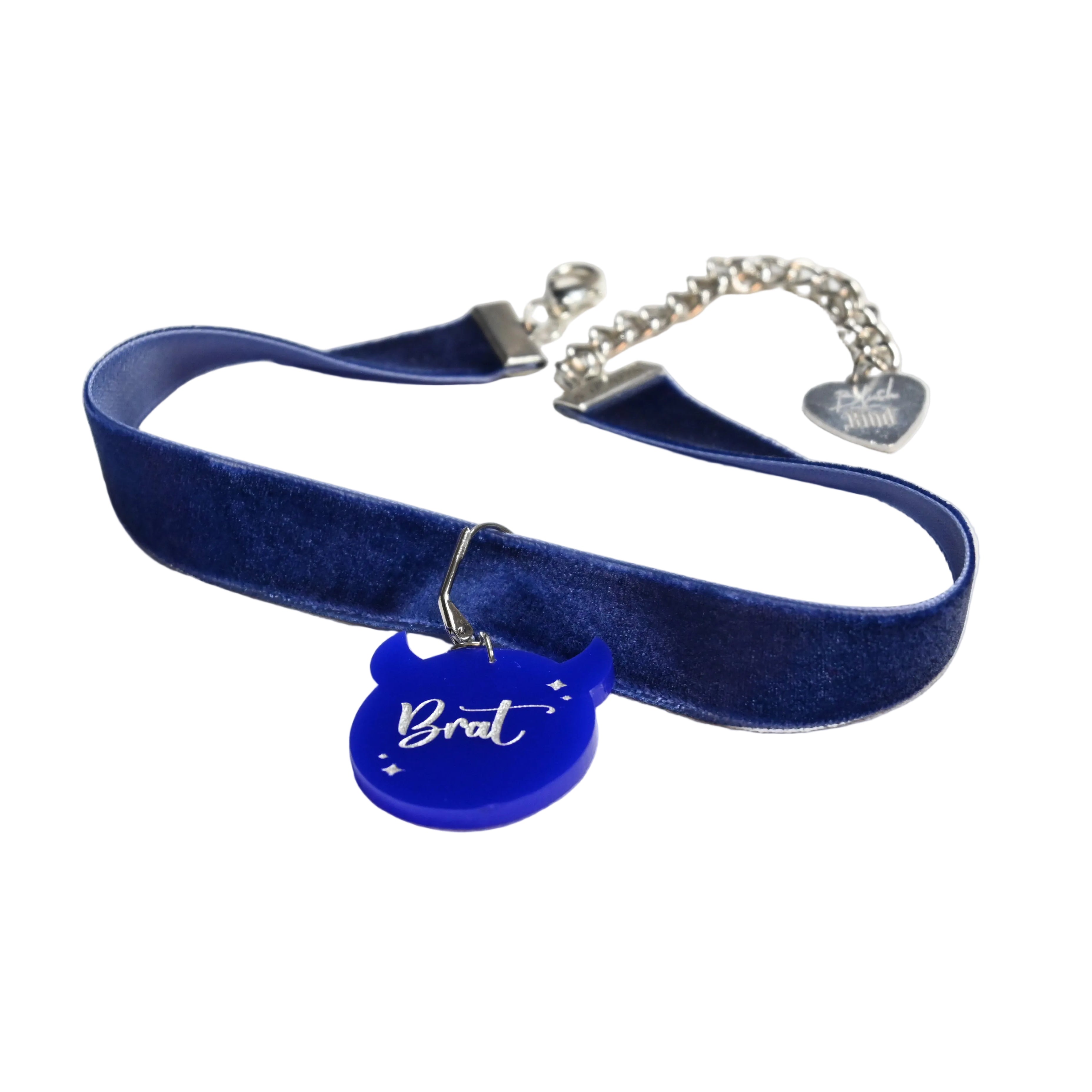 Blue velvet choker collar with silver toned hardware and blue brat charm.
