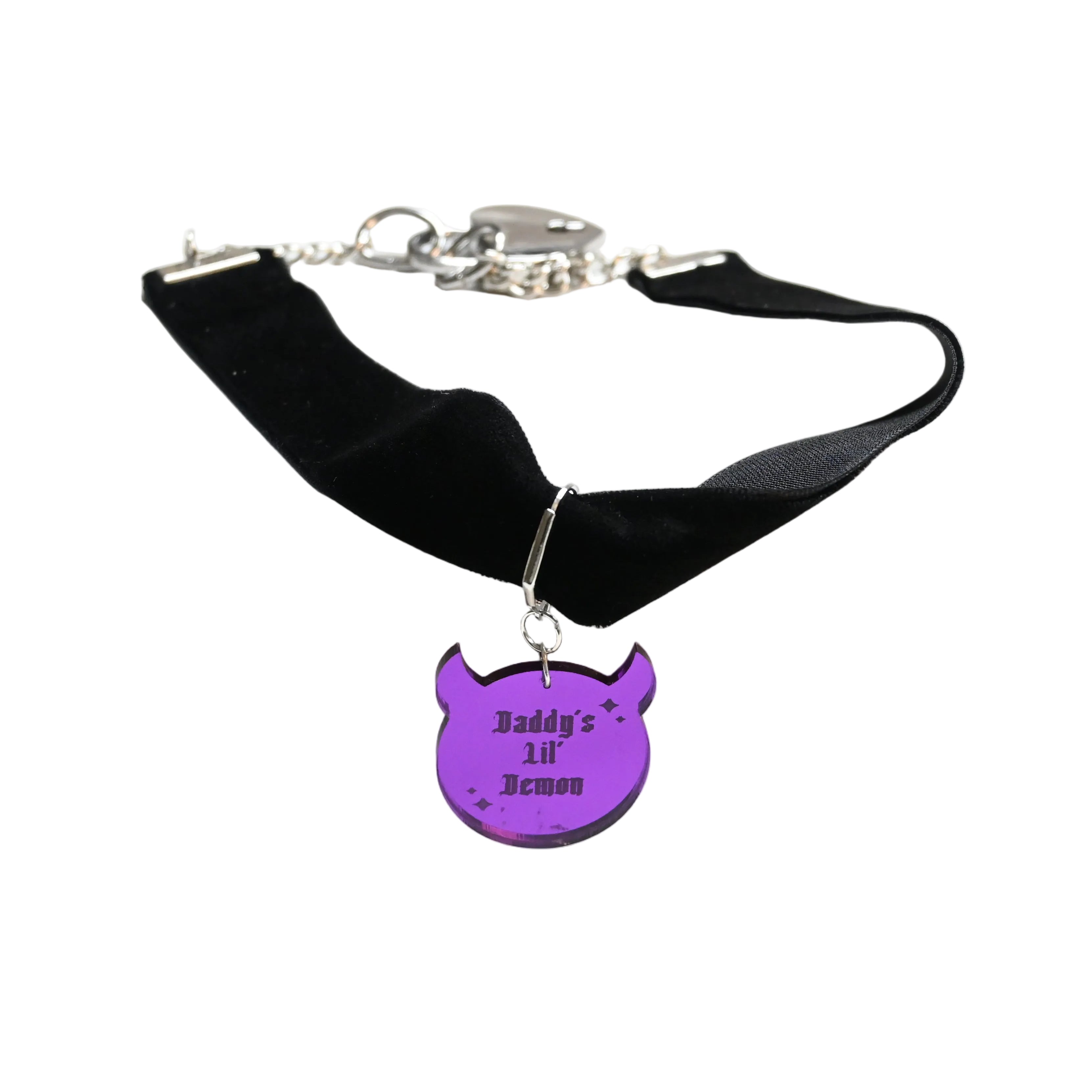 A black velvet collar with a silver clasp and a purple demon-shaped charm engraved with 'Daddy's LIL' Demon', displayed on a white background.